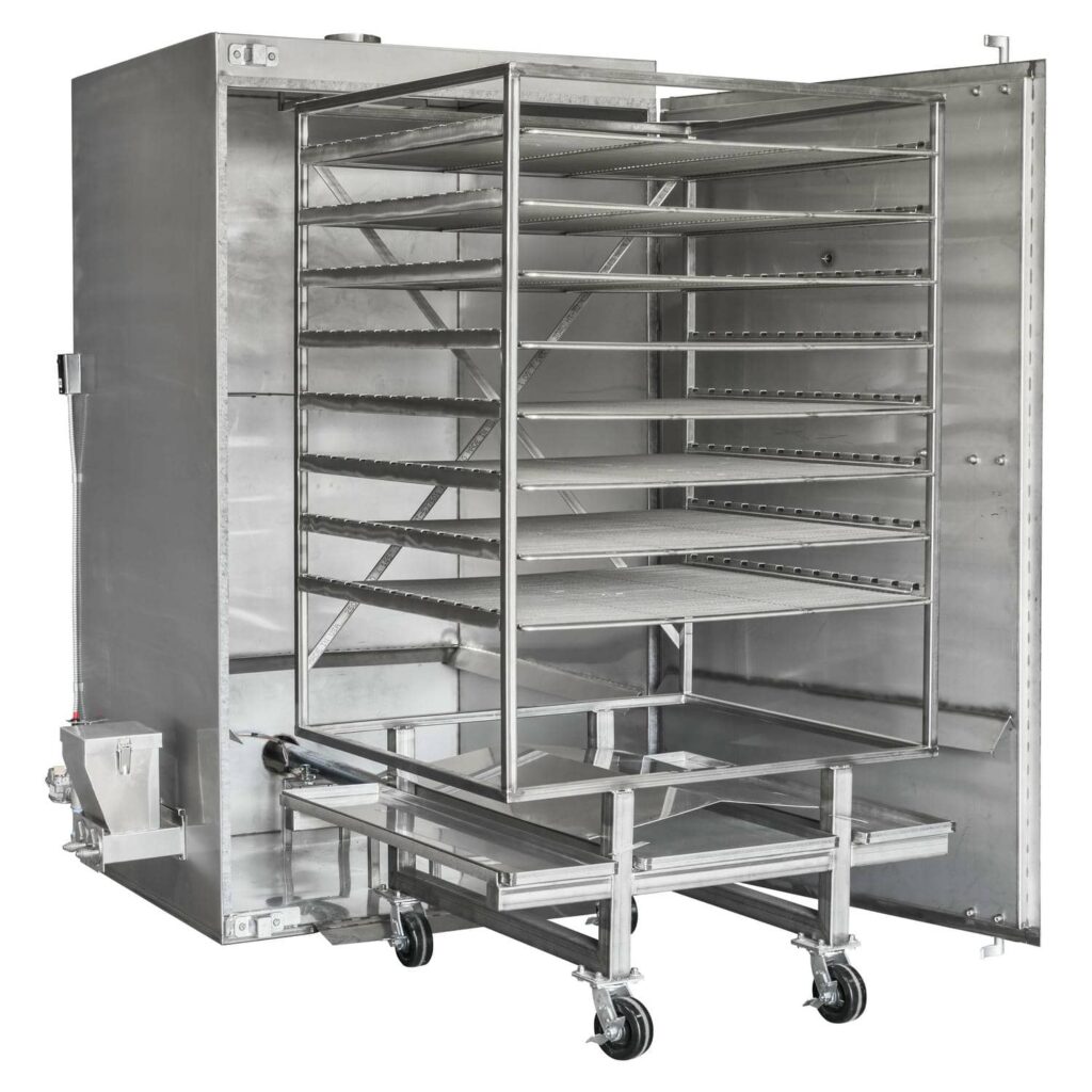 Angled view of a Rocket Outdoors roll-in gas smoker with door open, showing the wheeled rolling rack cart loaded into the cooking chamber.
