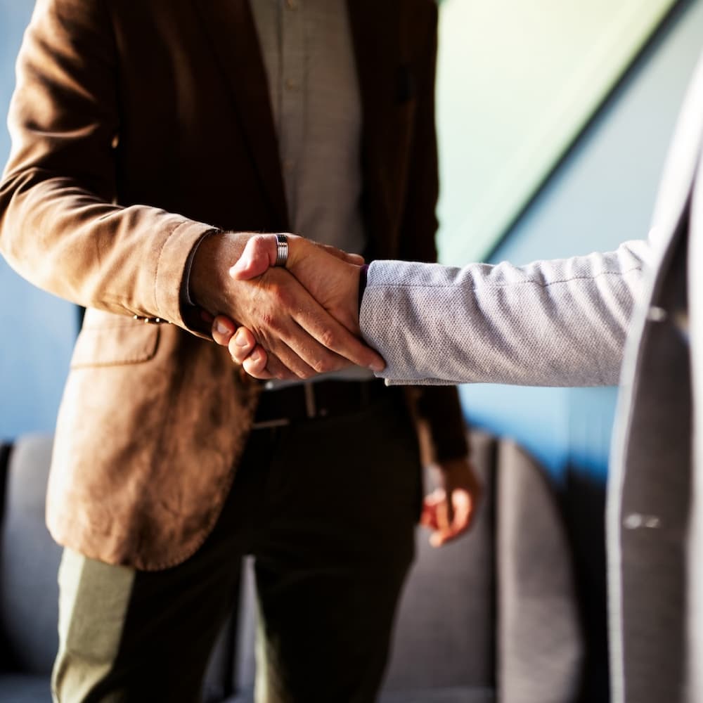 Rocket outdoors visit a dealer handshake